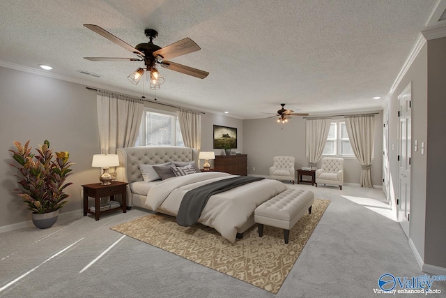 carpeted bedroom featuring ceiling fan, multiple windows, and a textured ceiling