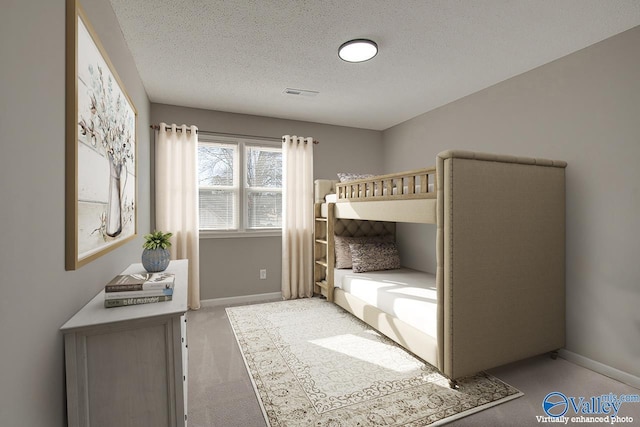 unfurnished bedroom featuring a textured ceiling