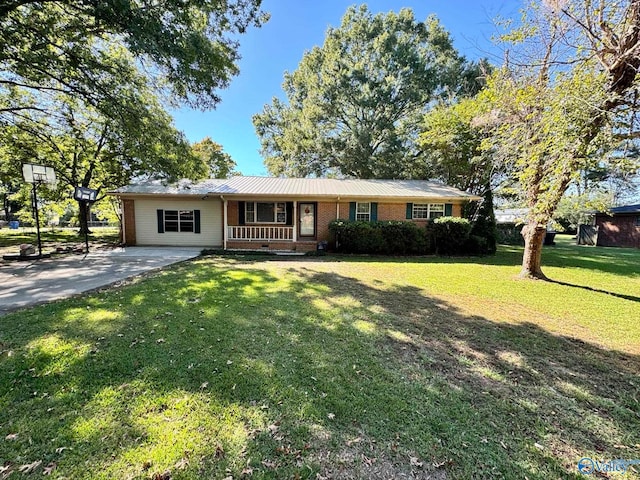 ranch-style house with a front yard and a porch