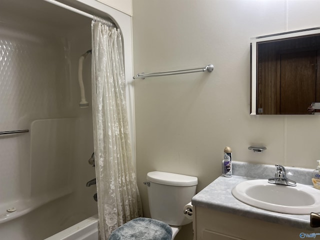 full bathroom featuring shower / bath combo with shower curtain, toilet, and vanity