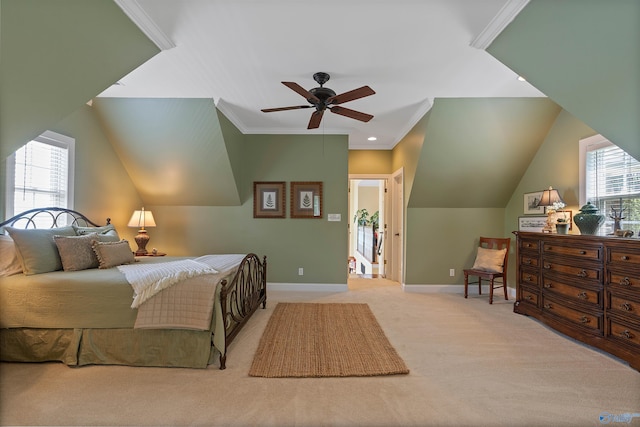 carpeted bedroom with ceiling fan and ornamental molding