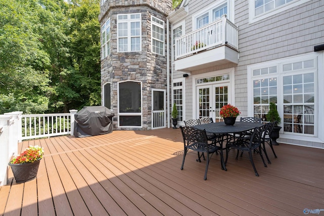 wooden deck featuring area for grilling