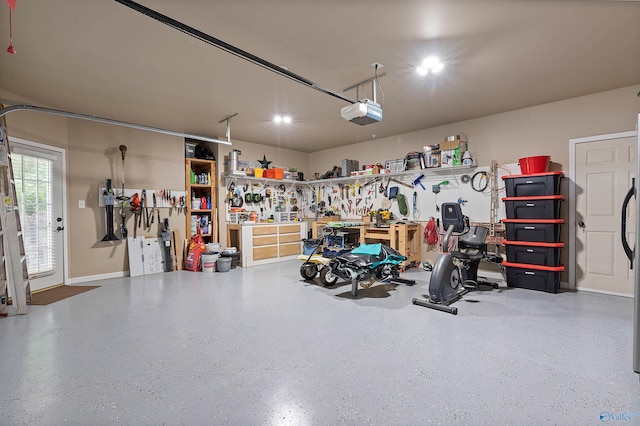 garage featuring a workshop area and a garage door opener