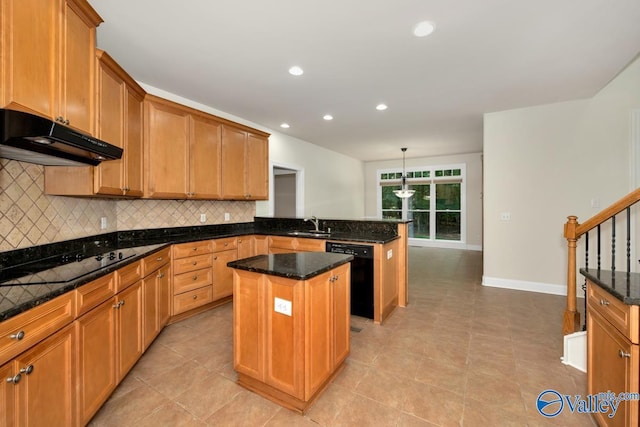118 Conservancy Dr, Madison, AL 35758 - kitchen with black appliances, under cabinet range hood, a peninsula, a center island, and decorative backsplash