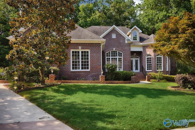 118 Conservancy Dr, Madison, AL 35758 - view of front of house with brick siding and a front lawn