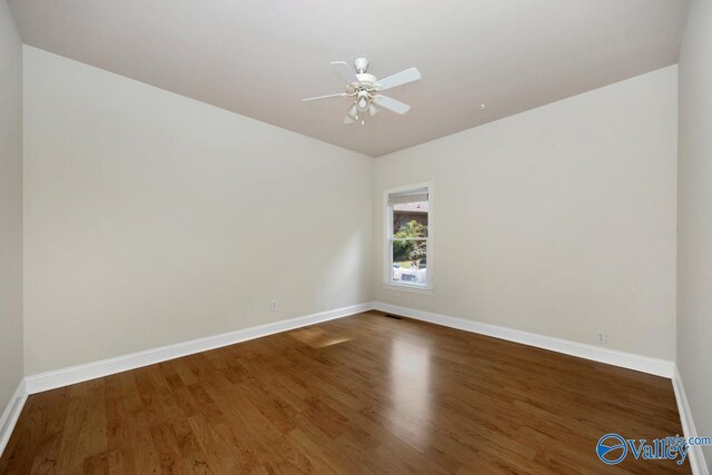 118 Conservancy Dr, Madison, AL 35758 - empty room with wood finished floors and ceiling fan