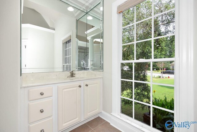 118 Conservancy Dr, Madison, AL 35758 - bathroom with vanity, tile patterned flooring, and ornate columns