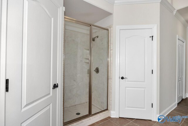 118 Conservancy Dr, Madison, AL 35758 - bathroom with a stall shower, crown molding, and tile patterned flooring