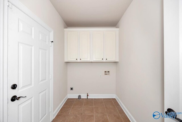 118 Conservancy Dr, Madison, AL 35758 - laundry room with cabinet space, washer hookup, light tile patterned floors, and hookup for an electric dryer