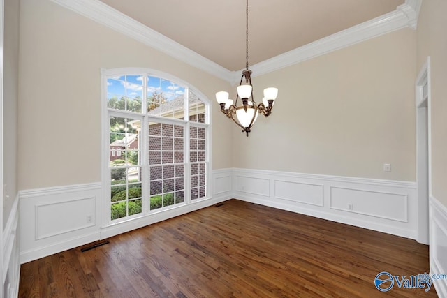 118 Conservancy Dr, Madison, AL 35758 - unfurnished dining area with a chandelier, crown molding, a wainscoted wall, dark wood-style floors, and a decorative wall