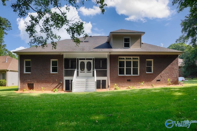118 Conservancy Dr, Madison, AL 35758 - back of house featuring brick siding, a lawn, and a sunroom