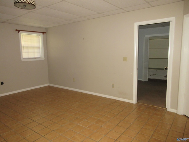 109 Colonial Dr, Scottsboro, AL 35768 - unfurnished room with a drop ceiling, baseboards, and light tile patterned floors