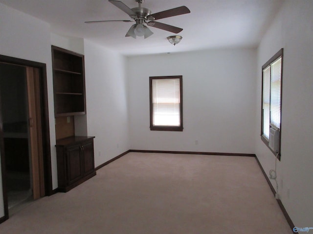 109 Colonial Dr, Scottsboro, AL 35768 - spare room featuring a ceiling fan, a healthy amount of sunlight, light carpet, and baseboards