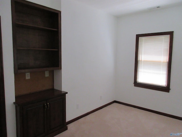 109 Colonial Dr, Scottsboro, AL 35768 - spare room with light carpet, visible vents, and baseboards