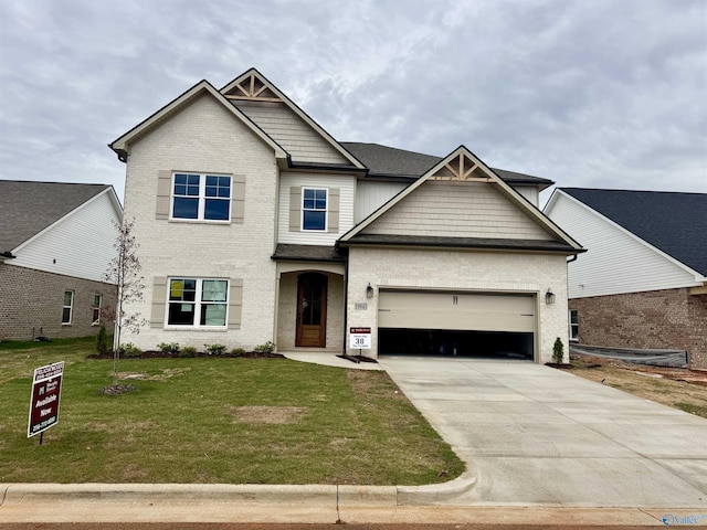 craftsman-style house with concrete driveway, a garage, brick siding, and a front yard