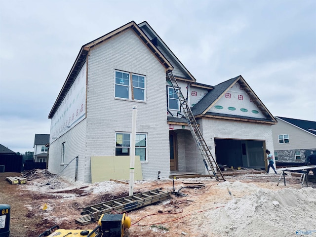 property in mid-construction featuring brick siding