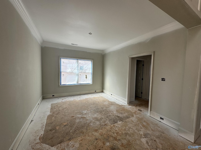 unfurnished room with baseboards and ornamental molding