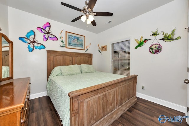 bedroom with dark wood-type flooring and ceiling fan