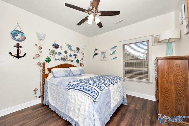 bedroom featuring ceiling fan and dark hardwood / wood-style flooring