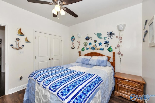 bedroom featuring a closet, dark hardwood / wood-style floors, and ceiling fan