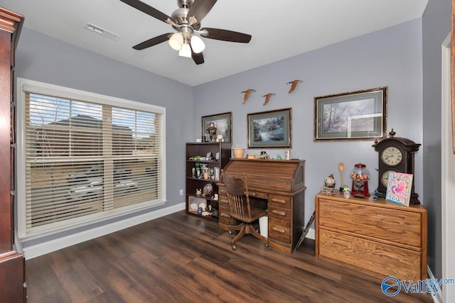 home office with dark wood-type flooring and ceiling fan