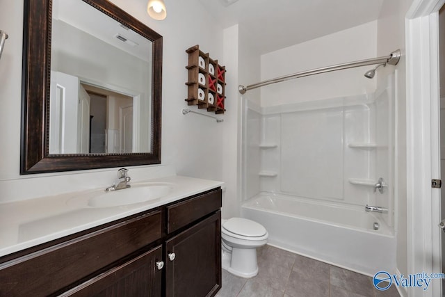 full bathroom featuring shower / bathtub combination, vanity, toilet, and tile patterned floors