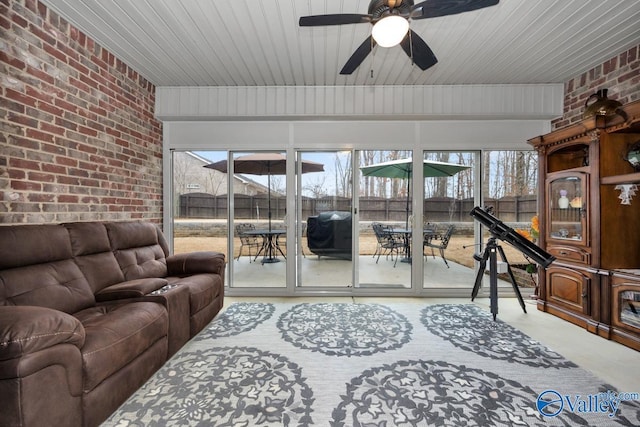 living room with ceiling fan, brick wall, and wooden ceiling