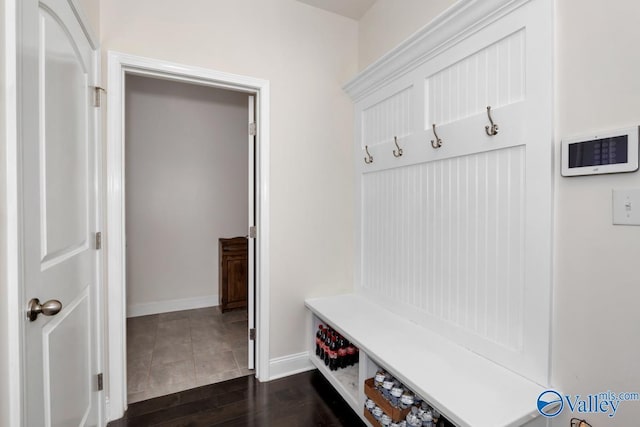 mudroom with dark hardwood / wood-style floors