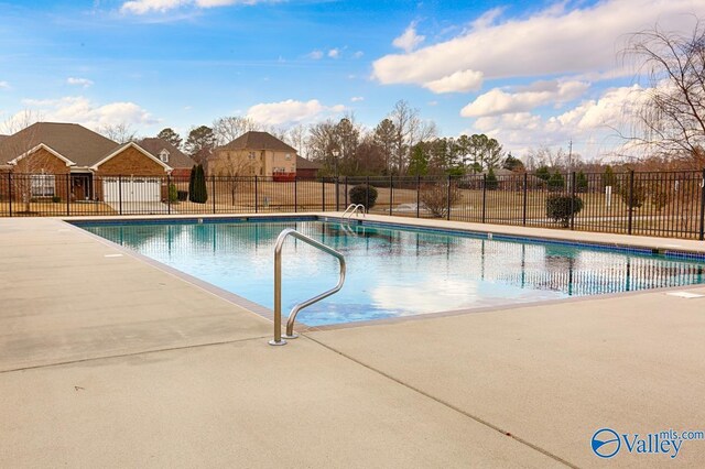 view of swimming pool featuring a patio area