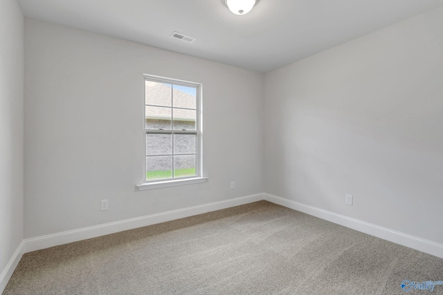 spare room featuring carpet