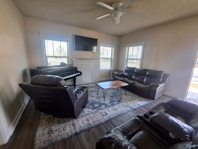 living room with wood finished floors, baseboards, a wealth of natural light, and ceiling fan