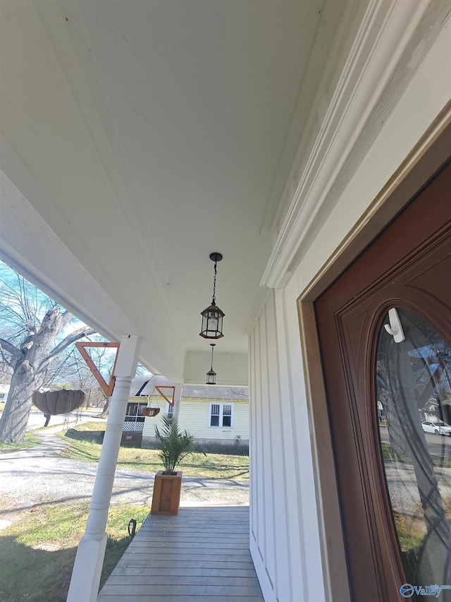 wooden terrace with a porch