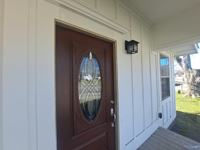 doorway to property with board and batten siding