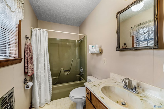 full bathroom featuring shower / bath combo, vanity, a textured ceiling, tile patterned flooring, and toilet