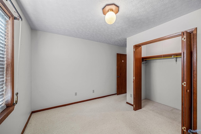 unfurnished bedroom featuring a closet and a textured ceiling