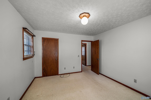 unfurnished bedroom with a textured ceiling