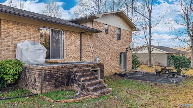 back of house with a patio area