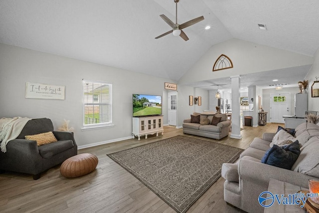 713 Rabbittown Rd, Glencoe, AL 35905 - living area with ornate columns, ceiling fan, high vaulted ceiling, wood finished floors, and baseboards