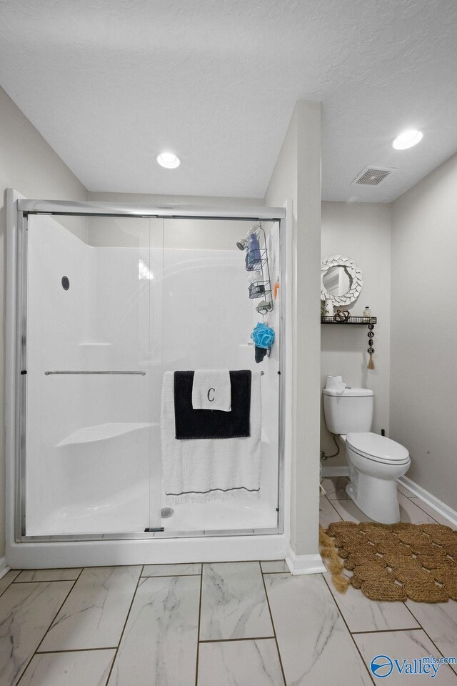 713 Rabbittown Rd, Glencoe, AL 35905 - full bath featuring marble look tile flooring, toilet, a stall shower, and recessed lighting