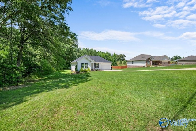 713 Rabbittown Rd, Glencoe, AL 35905 - view of green lawn with a garage and driveway