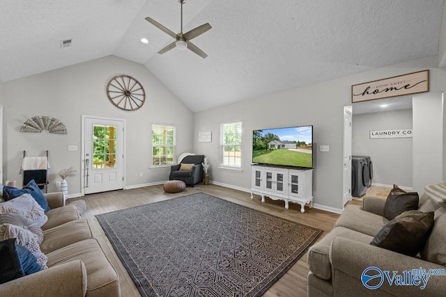 713 Rabbittown Rd, Glencoe, AL 35905 - living area featuring washing machine and dryer, a ceiling fan, wood finished floors, a textured ceiling, and baseboards