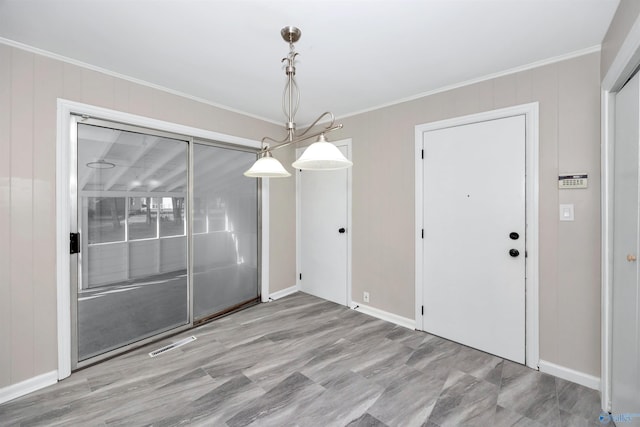 2501 Andrew Jackson Way NE, Huntsville, AL 35811 - unfurnished dining area featuring baseboards, ornamental molding, and visible vents