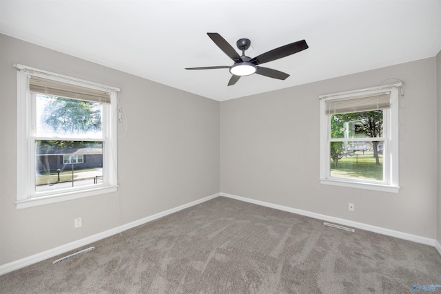 2501 Andrew Jackson Way NE, Huntsville, AL 35811 - carpeted spare room with baseboards, a ceiling fan, visible vents, and plenty of natural light