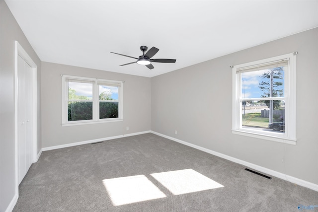 2501 Andrew Jackson Way NE, Huntsville, AL 35811 - unfurnished bedroom with baseboards, visible vents, and carpet