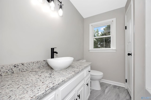 2501 Andrew Jackson Way NE, Huntsville, AL 35811 - bathroom with marble finish floor, baseboards, toilet, and vanity