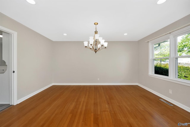 2501 Andrew Jackson Way NE, Huntsville, AL 35811 - spare room with wood finished floors, a chandelier, baseboards, visible vents, and recessed lighting
