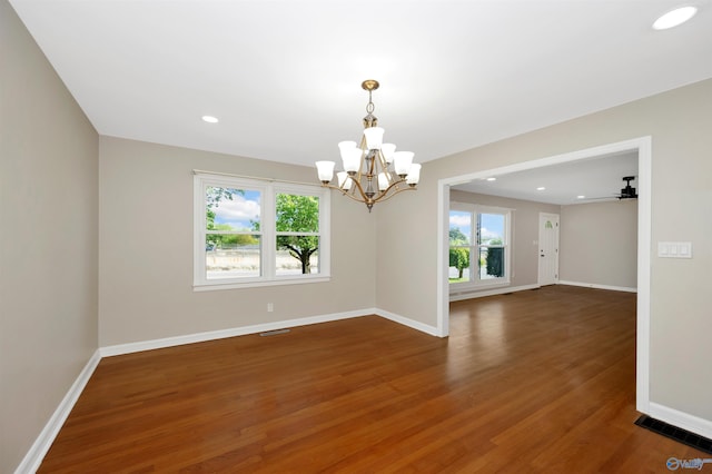 2501 Andrew Jackson Way NE, Huntsville, AL 35811 - empty room featuring wood finished floors, visible vents, baseboards, and an inviting chandelier