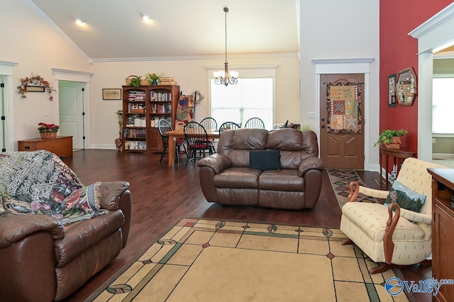 living room with ornamental molding, a chandelier, vaulted ceiling, and wood-type flooring