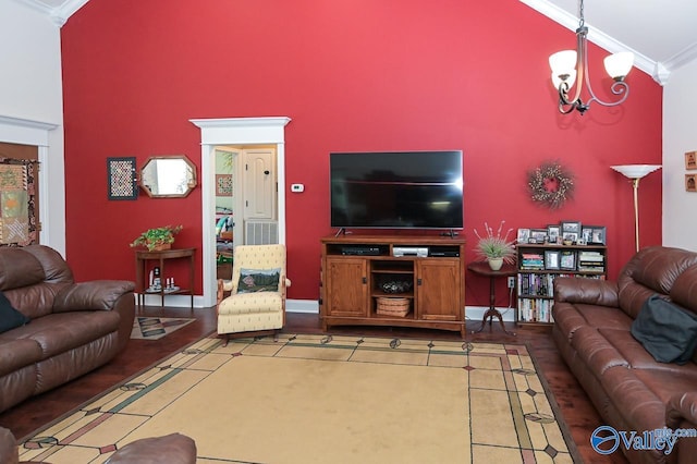 living room featuring crown molding, high vaulted ceiling, and a notable chandelier