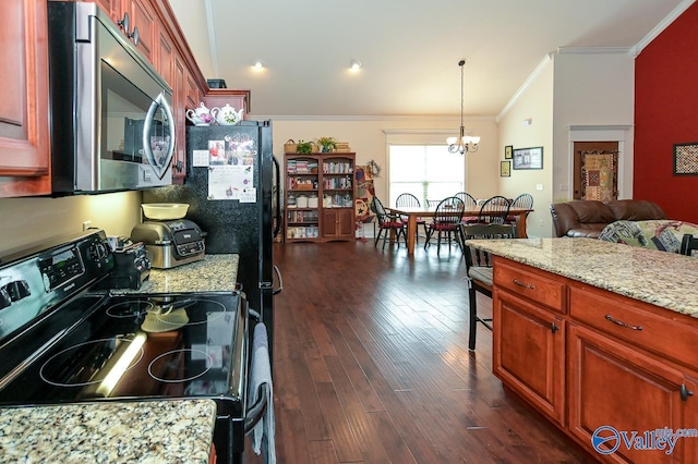 kitchen with hanging light fixtures, ornamental molding, electric range, light stone countertops, and dark wood-type flooring